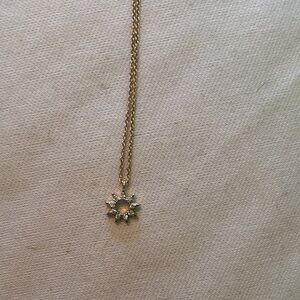 Elegant Gold and Silver Sunburst Pendant Necklace